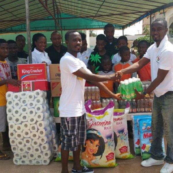 Friends of Aberga presenting items to the Teshie Orphanage