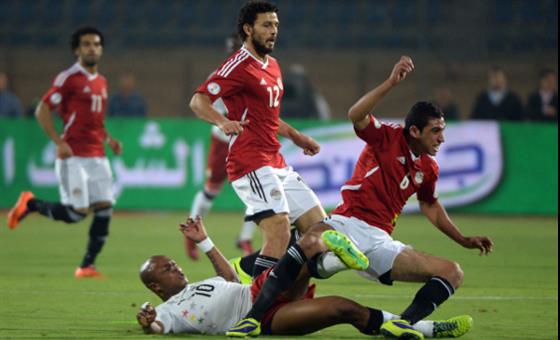 Is this picture depicting Egypt's position on Ghana? Dede is down fighting for the ball...