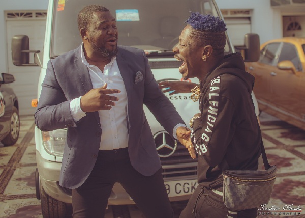 Shatta Wale with his manager, Bulldog