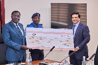 B5 Plus Group Chairman Mukesh Thakwani presenting GH¢400 million to GRA