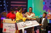 Samuel Owusu receiving a cash prize of Ten Thousand Ghana Cedis