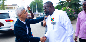 Sadiq Khan and Michael Kpakpo Allotey pictured exchanging pleasantaries
