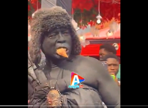 The traditional executioner chewing the head of a live fowl