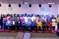 A group photo of media professionals and facilitators at the training