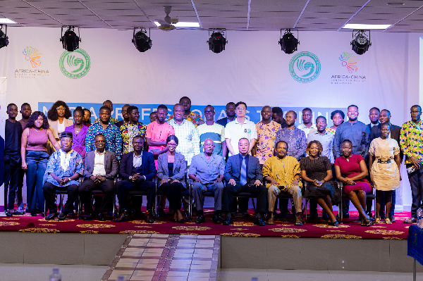 A group photo of media professionals and facilitators at the training