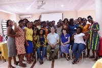 Some Newmont officials in a group photograph with midwives