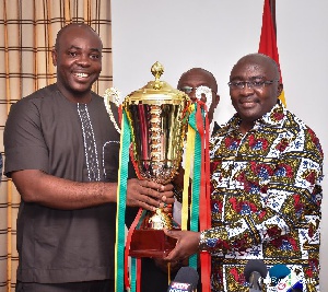 Vice President Dr. Mahamudu Bawumia and Sports Minister Isaac Asiamah displaying a trophy