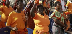 Opposition supporters cheer on the candidates during an election rally in Lomé