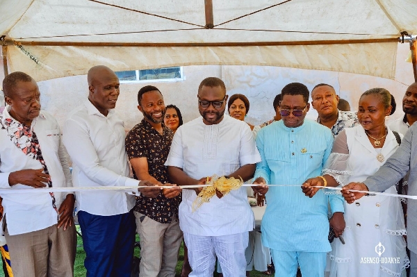 Asenso-Boakye cutting the tape to the borehole