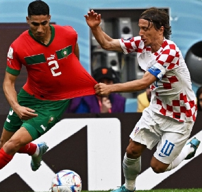 Morocco's Hakimi in a tussle with Luka Modric