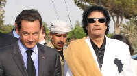 File photo of Gaddafi and ex French president Nicolas Sarkozy