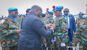 Dr. Bawumia Pinning Medals On Troops At A Colourful Ceremony.jpeg