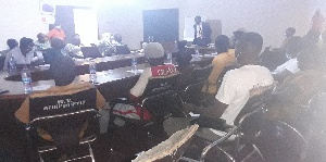 Mr. Yeboah (in suit) making a presentation at the workshop