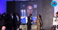 Nana Appiah Mensah, Chief executive officer (C.E.O) of Zylofon Media (L) receiving his award