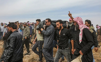 Mourners in southern Syria carry the bodies of people killed in Jordanian air strikes against ISIL '