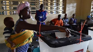 A Woman Casts Her Ballots