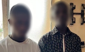 Australian police have released a blurred photo of two people arrested in Nigeria
