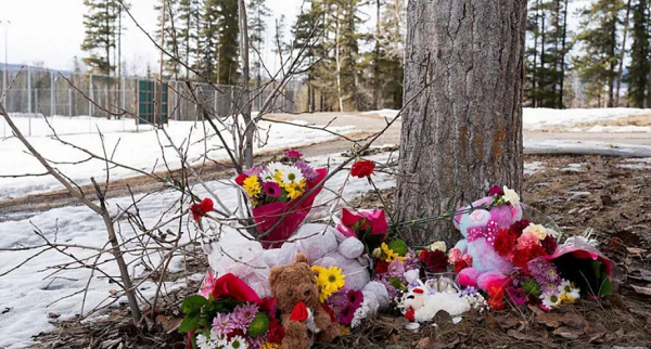 Mourners left flowers near the scene of the shooting in the remote Canadian town