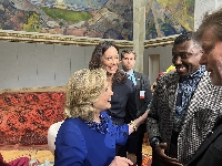 An elated Hillary Clinton with Larry Fataka in Oslo
