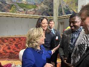 An elated Hillary Clinton with Larry Fataka in Oslo