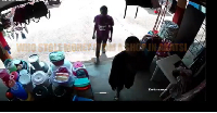 The two young boys captured entering the shop