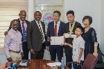 A group photo of Herbert Mensah and the team from the Chinese charity organization