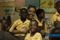 Actress, Nikki Samonas with school children
