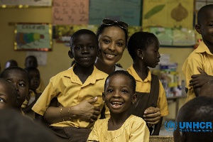 Actress, Nikki Samonas with school children