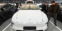 Tesla said it would place warning labels on the recalled vehicles