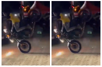 A KNUST student falls after his motorcycle overturns during an SRC Week celebration stunt