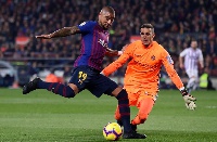 Barcelona's Kevin-Prince Boateng duels for the ball with Real Valladolid's Jordi Masip