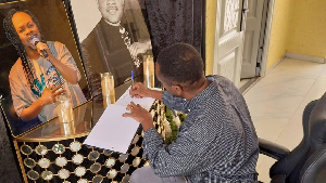 GhanaWeb's CEO, David Antwi signing the Book of Condolence for the late Daddy Lumba