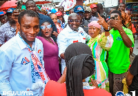 Dr. Bawumia with some market women during his campaign tour