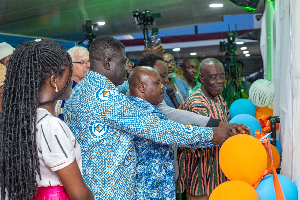 Joseph Cudjoe, Dr. Addo-Agyekum and other dignitaries cutting the ribbon for inauguration