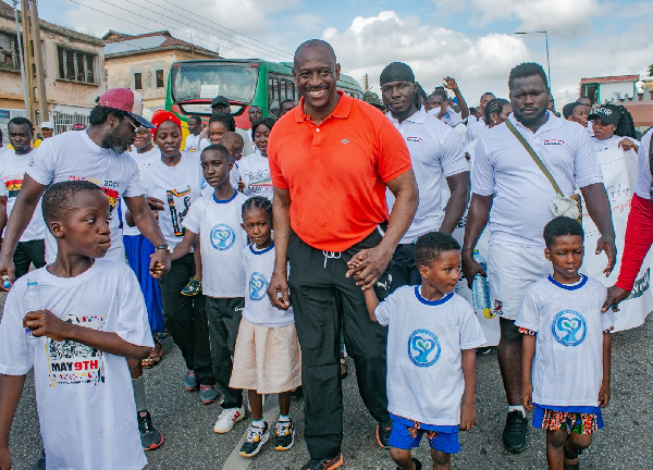Herbert Mensah with some of the children during the walk