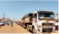 Trucks wait in a queue at the Ugandan side of the Busia border