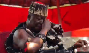 The Asantehene wiping his tears