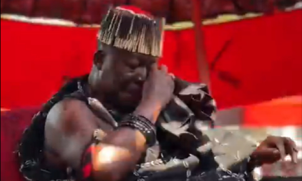 The Asantehene wiping his tears