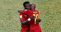 Former Black Stars midfielder, Sulley Ali Muntari hugs Dede Ayew during 2014 WC