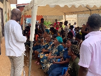 Rev. Eric Okpoti-Paulo interacting with some of the people