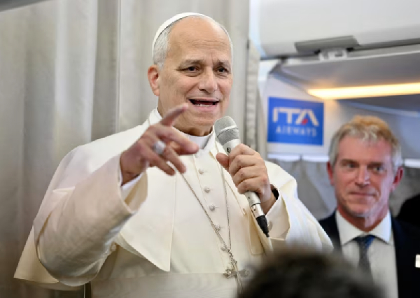 Pope Leo XIV speaks to journalists aboard a flight to Rome