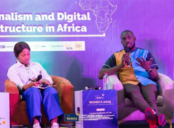 Abdul Razak Issaka Ali on the right speaking at a conference