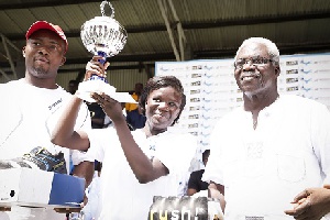 Francisca Nyarko (middle) lifts trophy