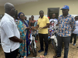 Hajia Kande presenting the motorcycles to the party executives