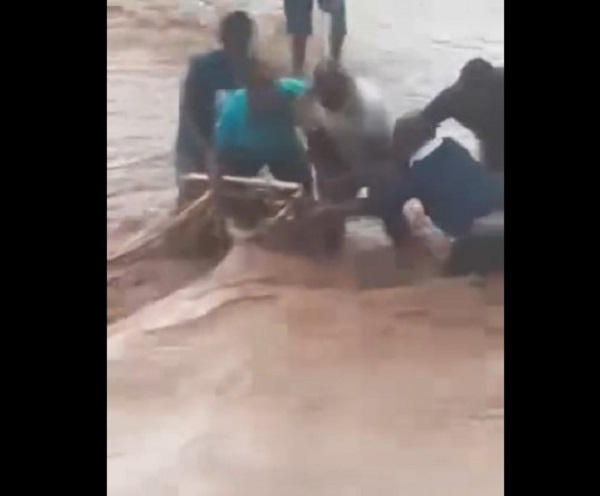 The man being rescued from the drainage