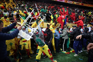 Senegal fans clash security after Morocco VAR penalty sparks pitch invasion