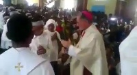 Reverend Father flogs church members with cane.