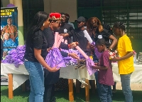 Eze Dr Chukwudi Ihenetu presenting some of the children with gifts