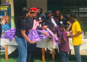 Eze Dr Chukwudi Ihenetu presenting some of the children with gifts
