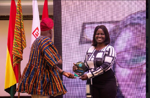 Baroness Mrs. Mavis Leonards receiving her award